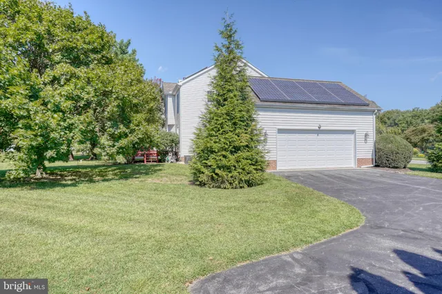 an aerial view of a house with outdoor space