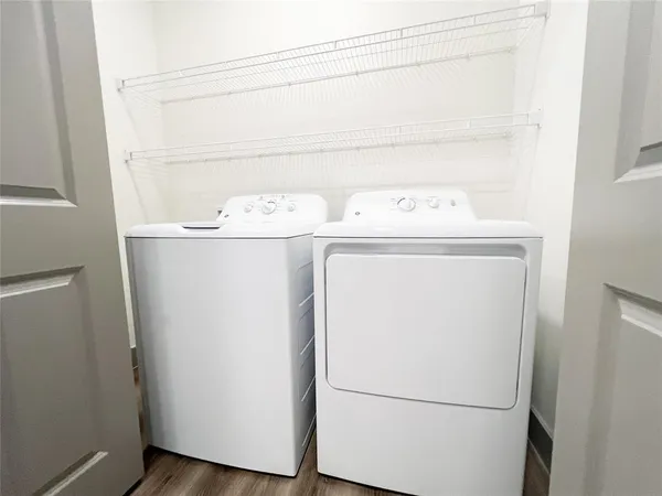 a view of a room that has a table and chair in it