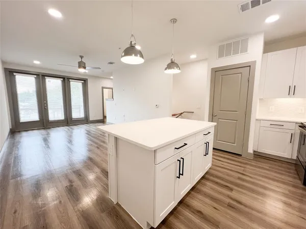 a kitchen with a stove and a sink
