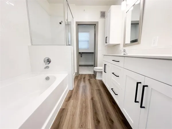 a view of a room with rack on the wall and a window