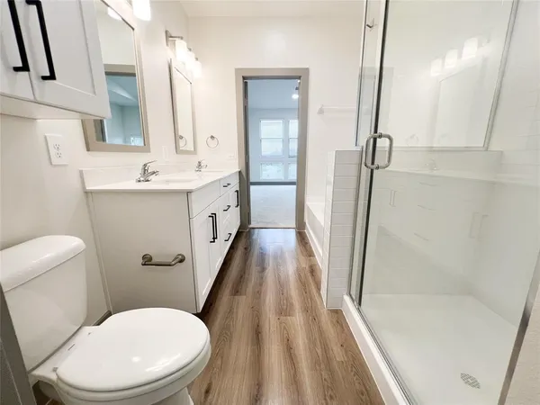 a bathroom with a bathtub and a sink