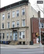 256 Withers Street Brooklyn, NY 11211 - Photo 1 of 14 a front view of a building and car parked