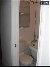 256 Withers Street Brooklyn, NY 11211 - Photo 11 of 14 a white toilet sitting next to a bathroom sink