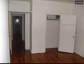 256 Withers Street Brooklyn, NY 11211 - Photo 12 of 14 a view of a hallway with wooden floor