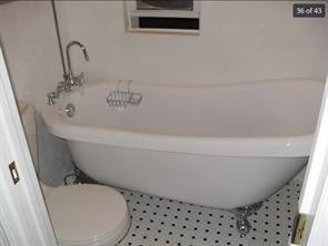 256 Withers Street Brooklyn, NY 11211 - Photo 13 of 14 a bathroom with a bathtub and toilet