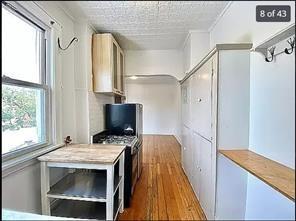 256 Withers Street Brooklyn, NY 11211 - Photo 3 of 14 a view of living room with furniture and a flat screen tv