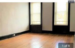 256 Withers Street Brooklyn, NY 11211 - Photo 6 of 14 a view of an empty room with a window