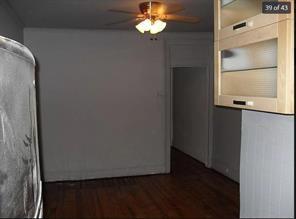 256 Withers Street Brooklyn, NY 11211 - Photo 7 of 14 a view of a chandelier fan and fire place