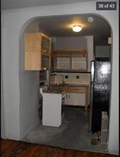 256 Withers Street Brooklyn, NY 11211 - Photo 8 of 14 a kitchen with a sink and cabinets