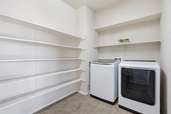 a utility room with washing machine