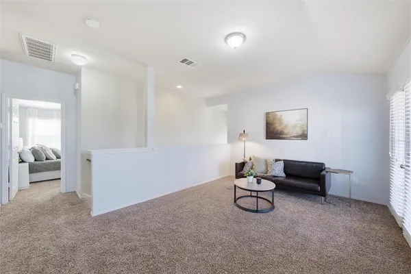 a room with furniture and gym equipment