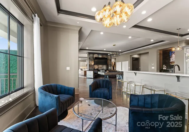 a living room with furniture rug and large window
