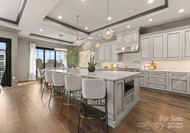 a room with a couch and chandelier