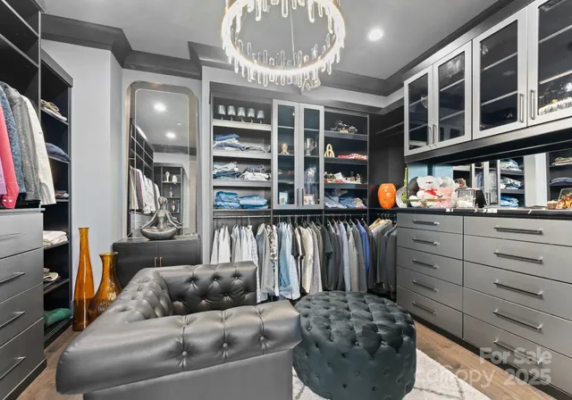 a bathroom with a granite countertop sink a toilet and mirror