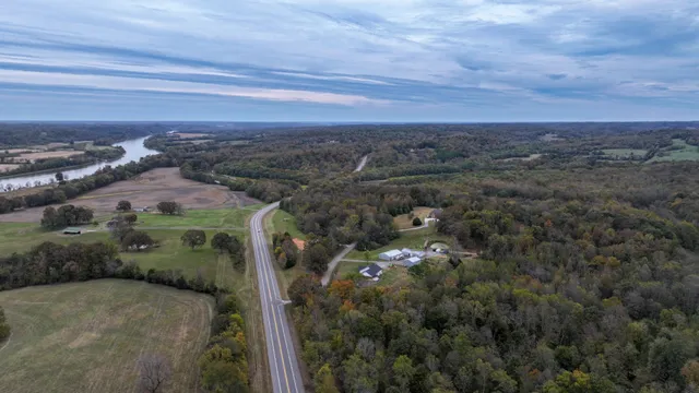 an aerial view of a houses with a yard