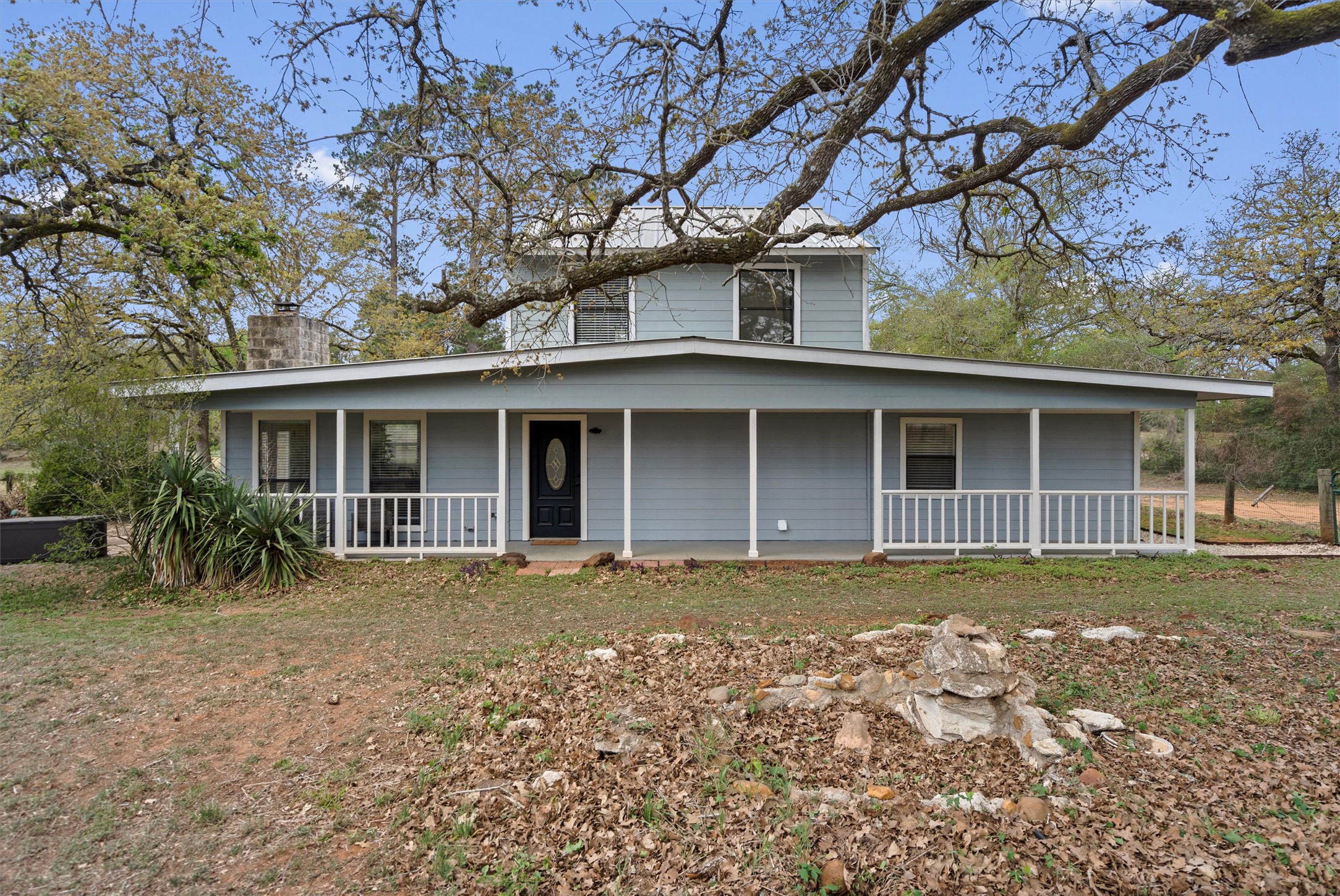 836 Cottle Town Road Smithville, TX 78957 - Photo 2 of 40 Country-style home featuring a chimney and covered porch
