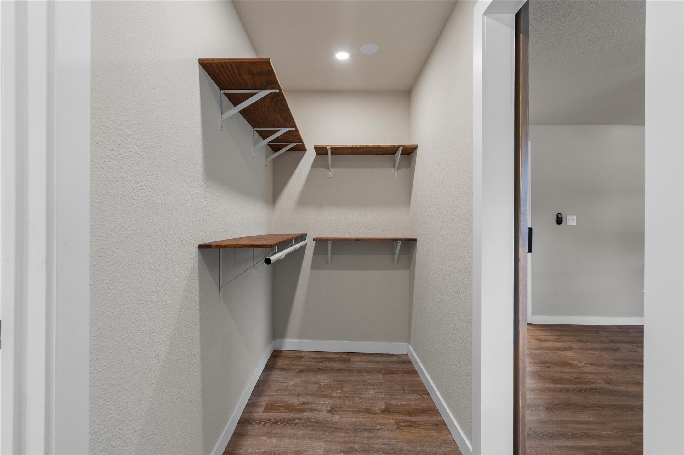 836 Cottle Town Road Smithville, TX 78957 - Photo 20 of 40 Walk in closet featuring wood finished floors