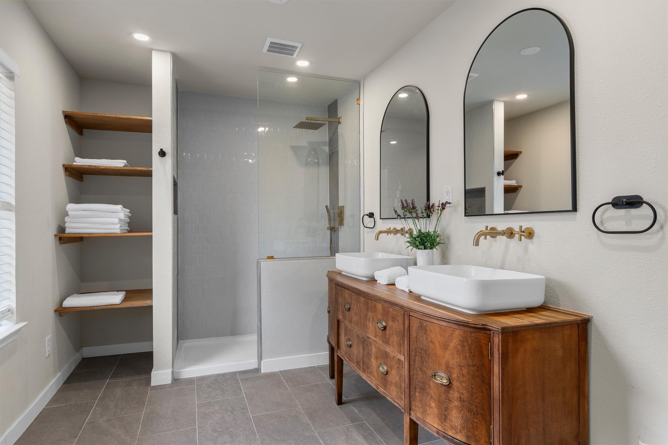 836 Cottle Town Road Smithville, TX 78957 - Photo 21 of 40 Bathroom featuring double vanity, walk in shower, light tile patterned flooring, and recessed lighting