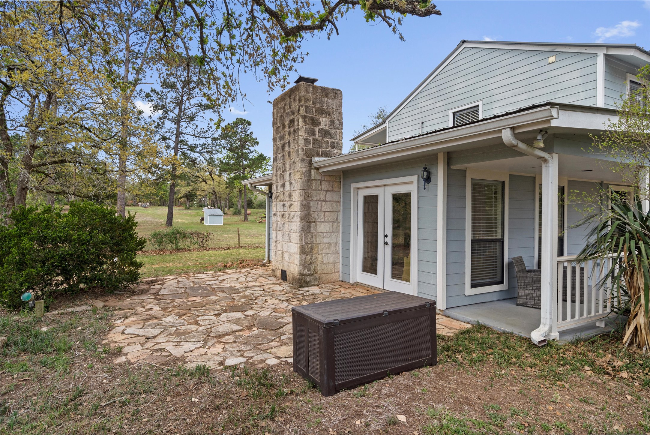 836 Cottle Town Road Smithville, TX 78957 - Photo 4 of 40 Rear view of house with a patio, french doors, and a chimney