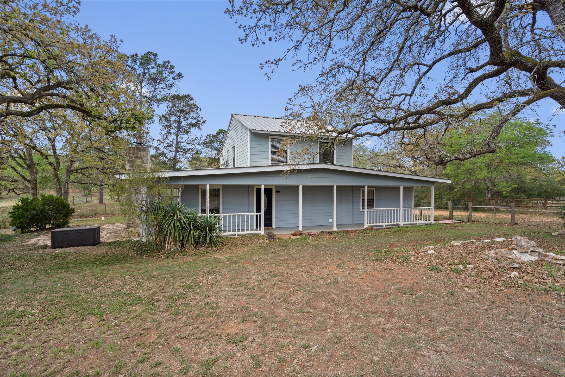 836 Cottle Town Road Smithville, TX 78957 - Photo 7 of 40 View of front of property with a metal roof and covered porch
