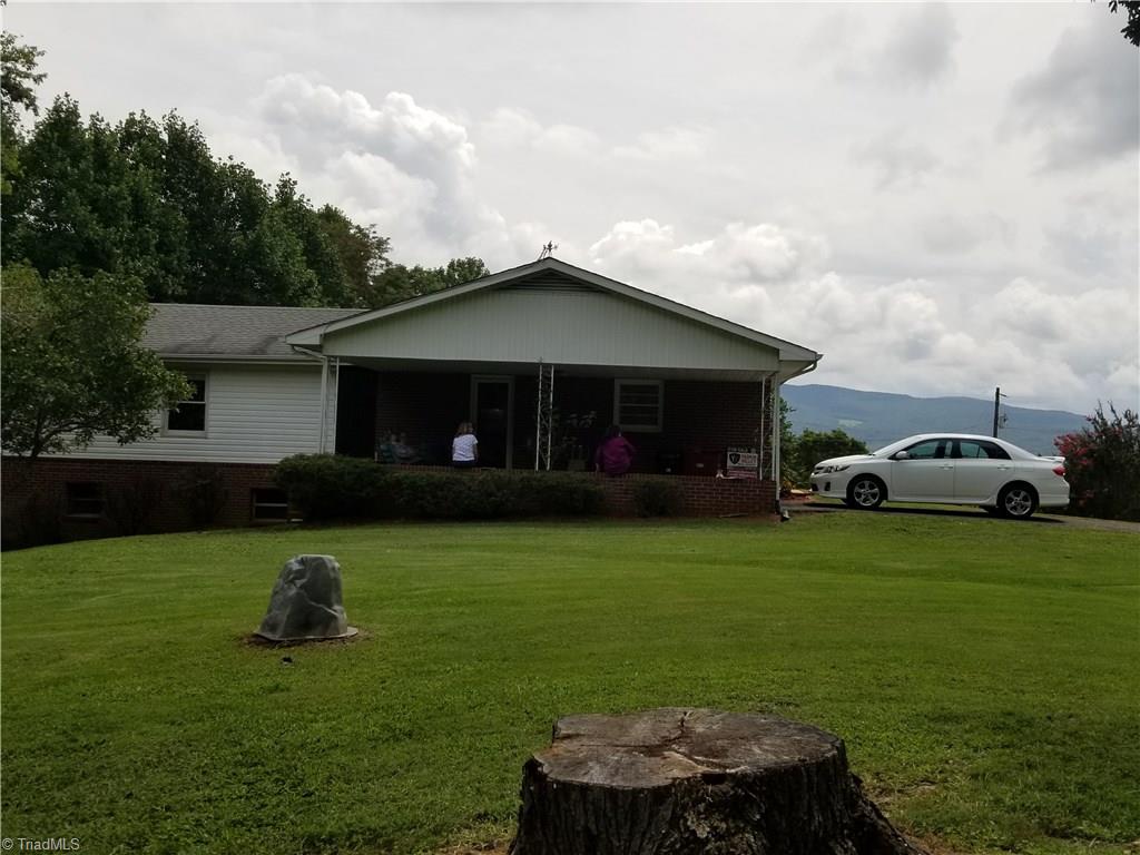 1802 Simmons Road Westfield, NC 27053 - Photo 7 of 29 Side view of home with mountain backdrop