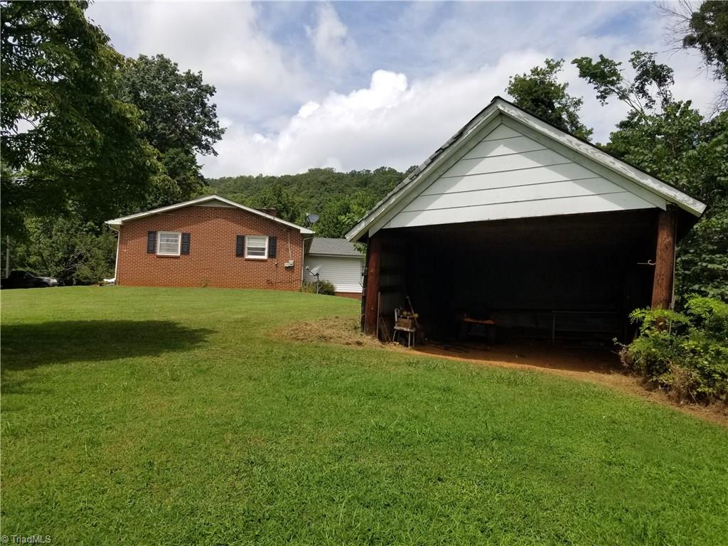 1802 Simmons Road Westfield, NC 27053 - Photo 8 of 29 Side view with storage shed.