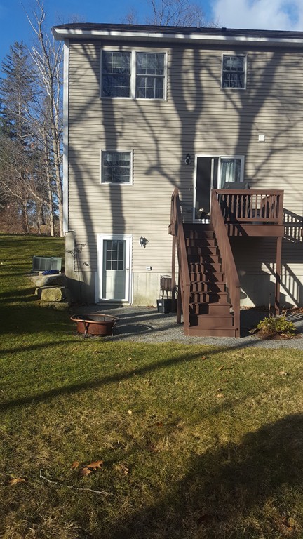 111 Beach Road, Unit 28 Salisbury, MA 01952 - Photo 13 of 14 a view of a house with a yard