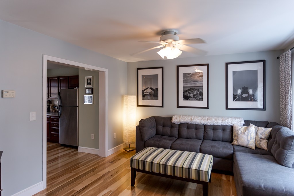 111 Beach Road, Unit 28 Salisbury, MA 01952 - Photo 2 of 14 a living room with furniture and a wooden floor