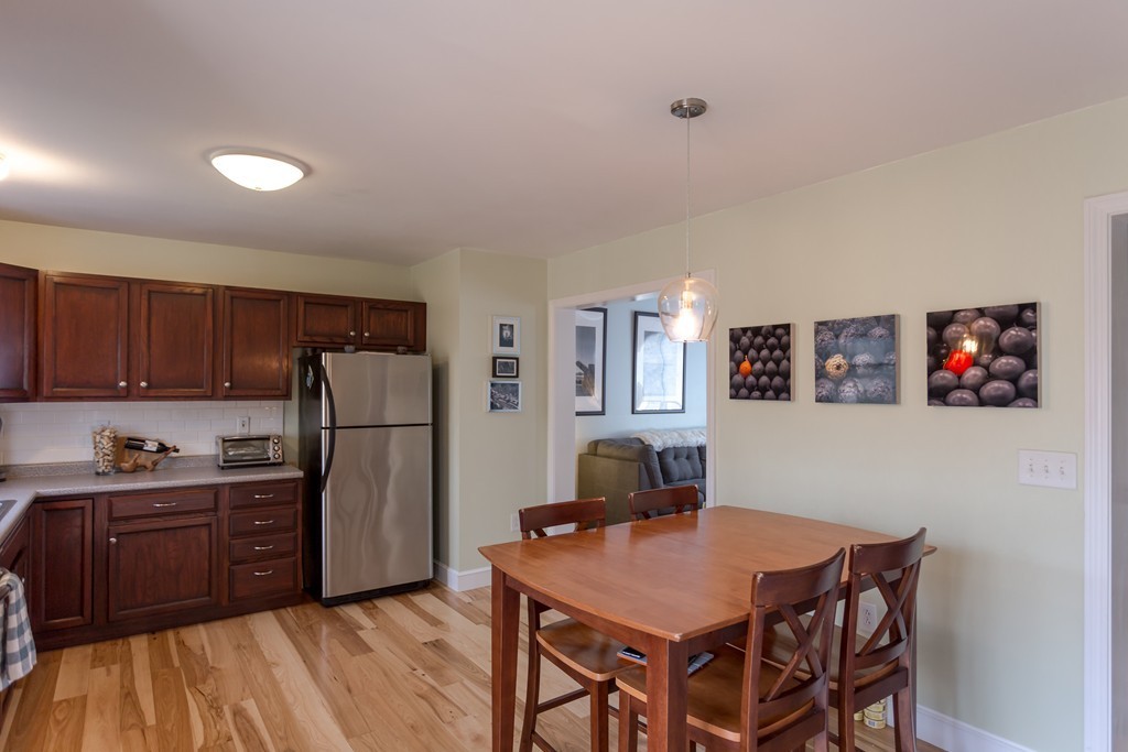 111 Beach Road, Unit 28 Salisbury, MA 01952 - Photo 5 of 14 a kitchen with stainless steel appliances a refrigerator and a counter space
