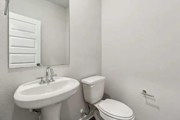 a bedroom with bed and a window