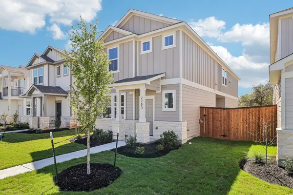 a front view of a house with garden