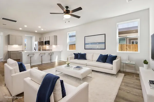 a kitchen with stainless steel appliances granite countertop a stove and a refrigerator