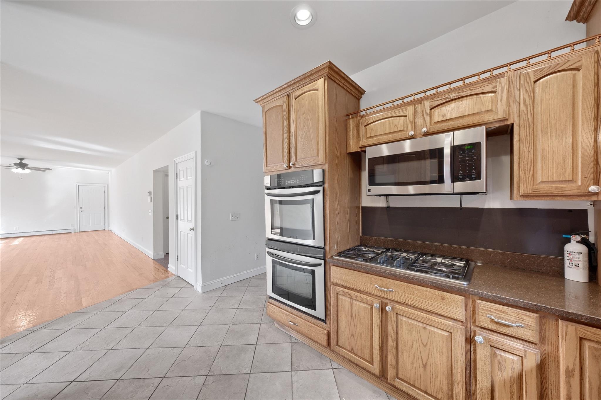 115 E Road Wurtsboro, NY 12790 - Photo 12 of 33 a kitchen with stainless steel appliances granite countertop a refrigerator and cabinets