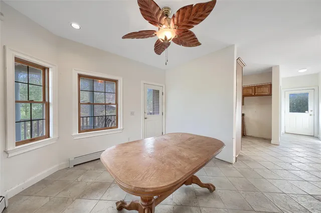 a kitchen with stainless steel appliances granite countertop a refrigerator and cabinets