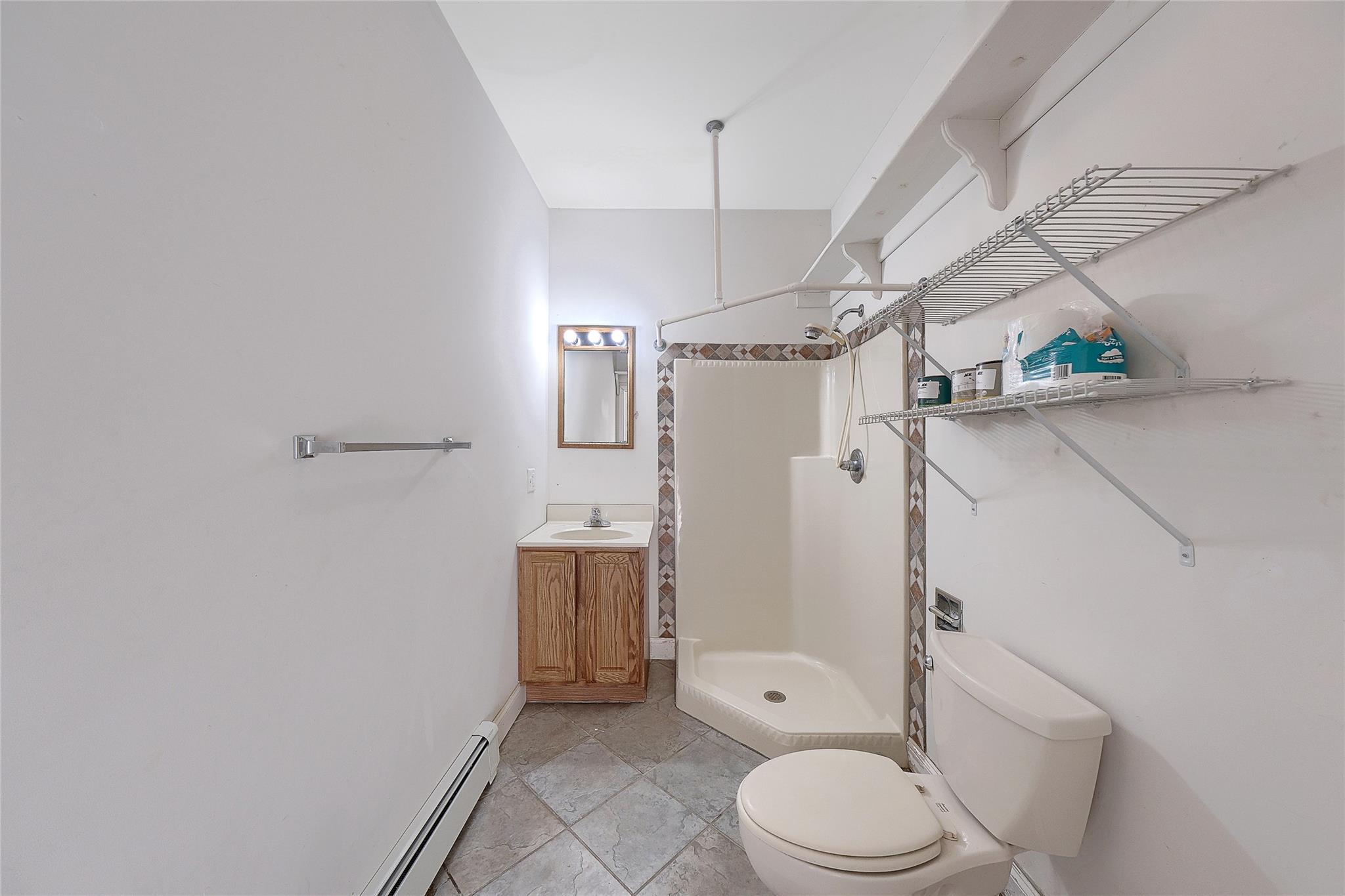 115 E Road Wurtsboro, NY 12790 - Photo 14 of 33 a white toilet sitting next to a bathroom sink