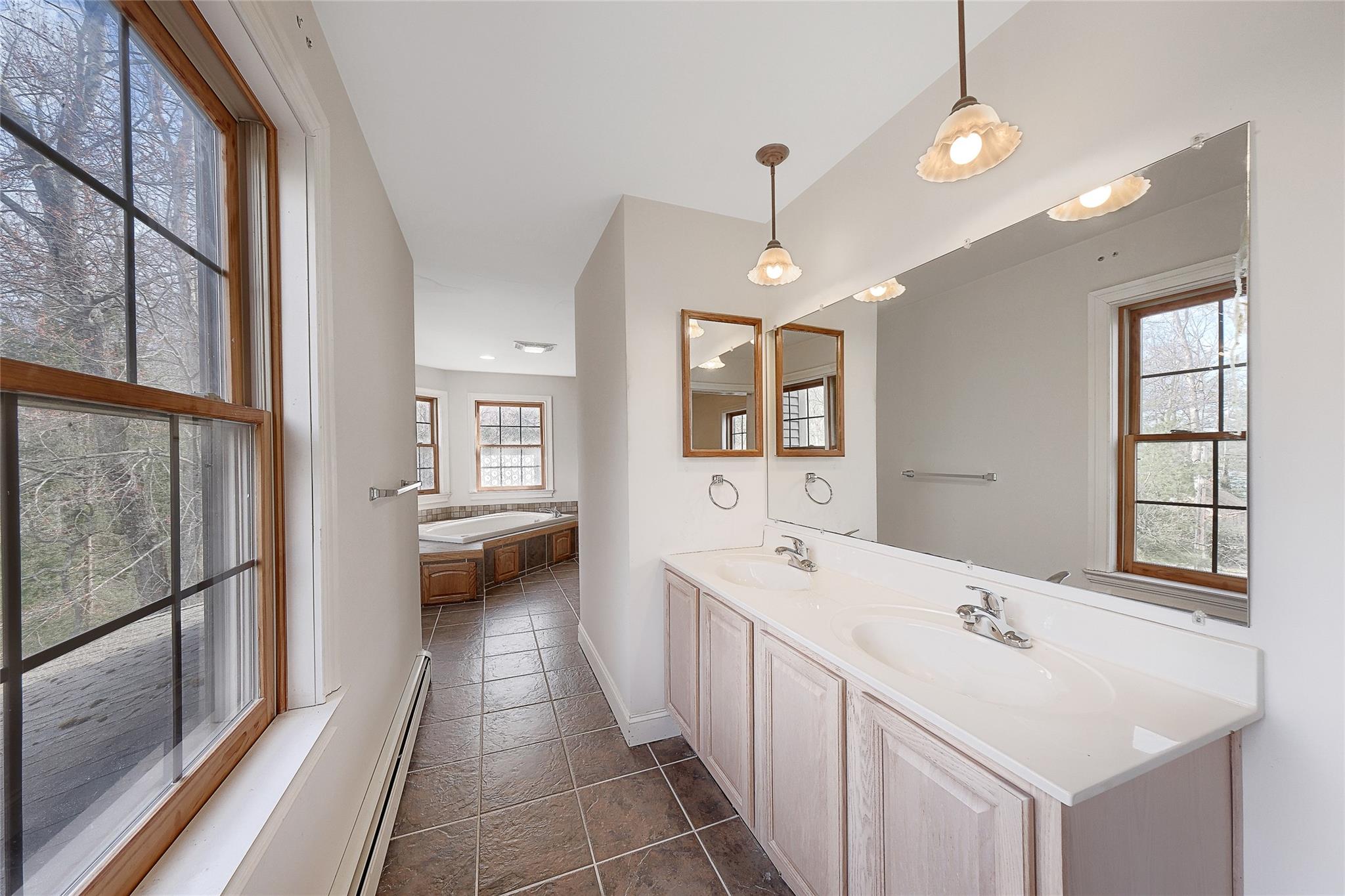 115 E Road Wurtsboro, NY 12790 - Photo 24 of 33 a bathroom with a sink a large mirror and vanity
