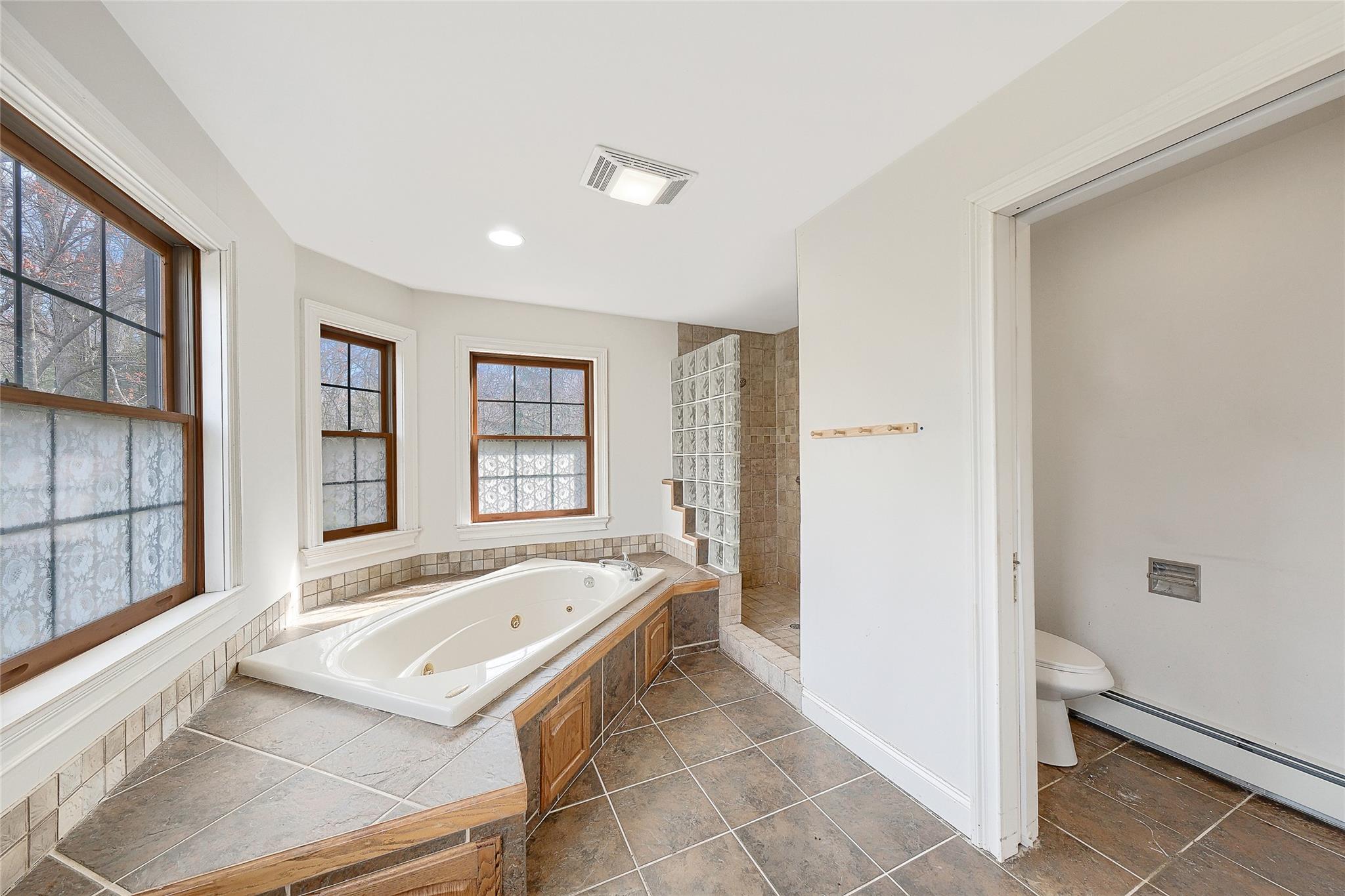 115 E Road Wurtsboro, NY 12790 - Photo 26 of 33 a bathroom with a tub sink and mirror