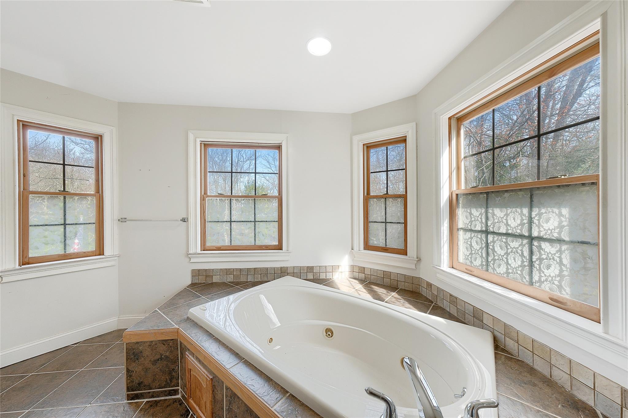 115 E Road Wurtsboro, NY 12790 - Photo 28 of 33 a bath tub sitting in a bathroom next to a window
