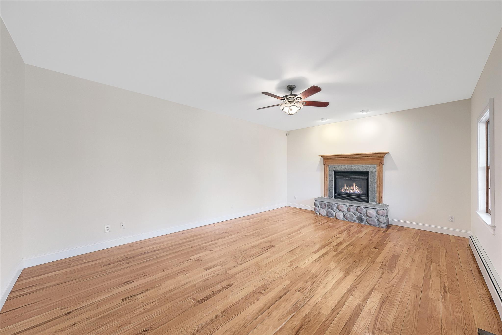 115 E Road Wurtsboro, NY 12790 - Photo 3 of 33 a view of an empty room with wooden floor