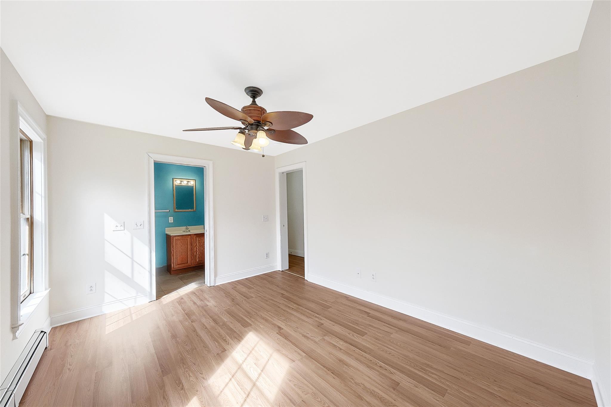 115 E Road Wurtsboro, NY 12790 - Photo 30 of 33 a bedroom with a bed and a chandelier