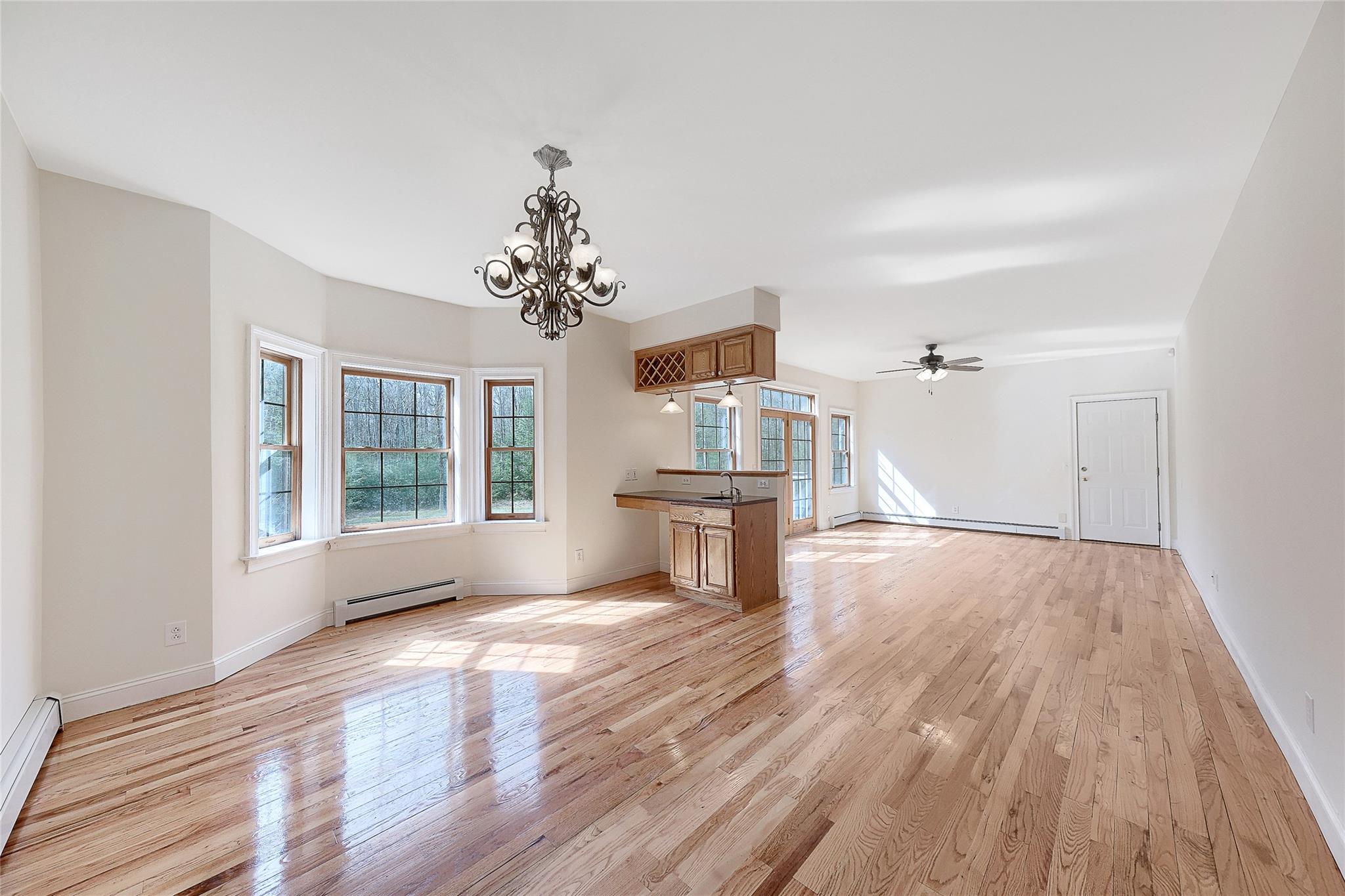 115 E Road Wurtsboro, NY 12790 - Photo 5 of 33 a view of empty room with wooden floor and fan