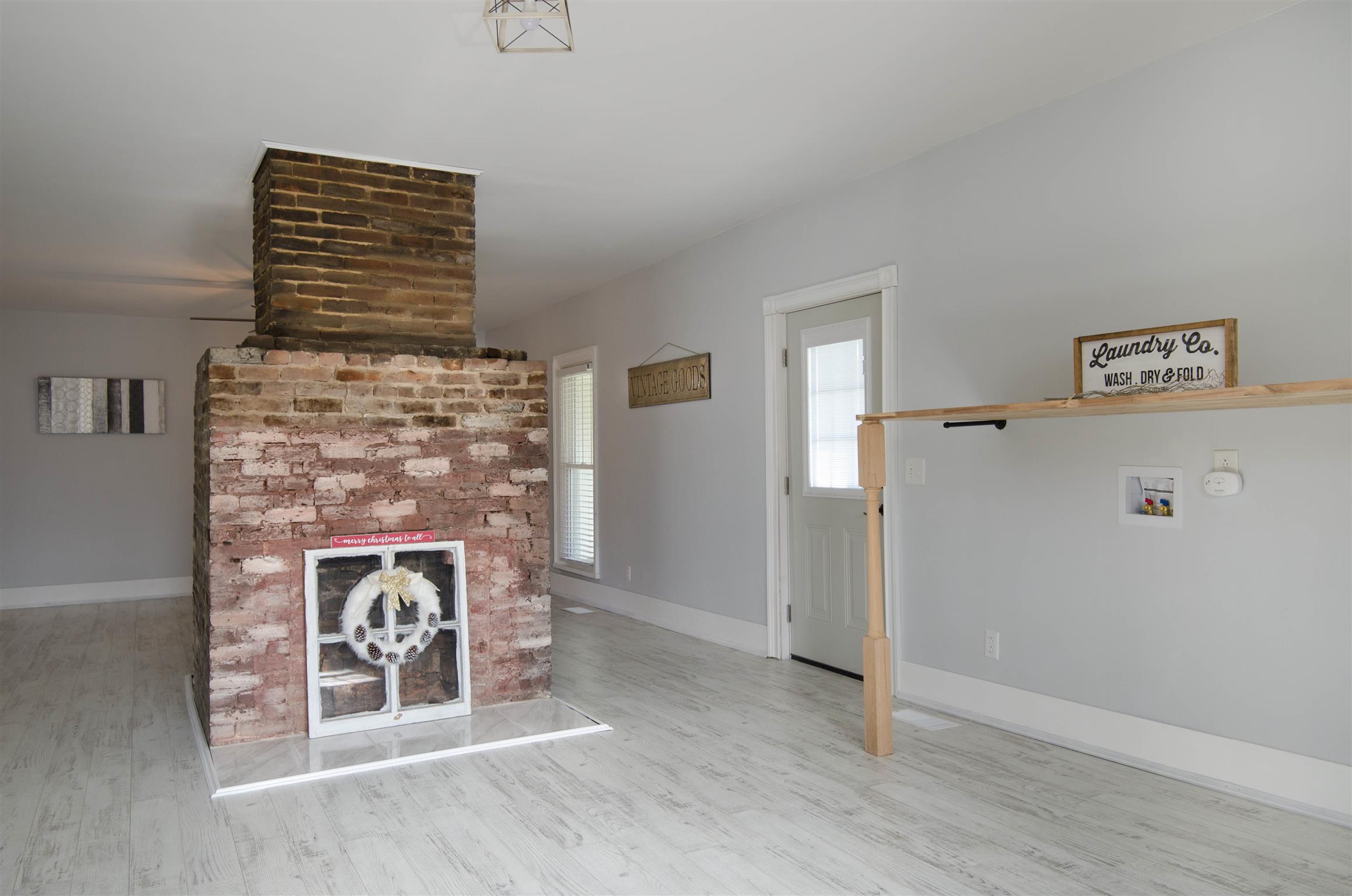 4 Rome First Street Lebanon, TN 37087 - Photo 19 of 25 a view of an empty room with wooden floor and a fireplace