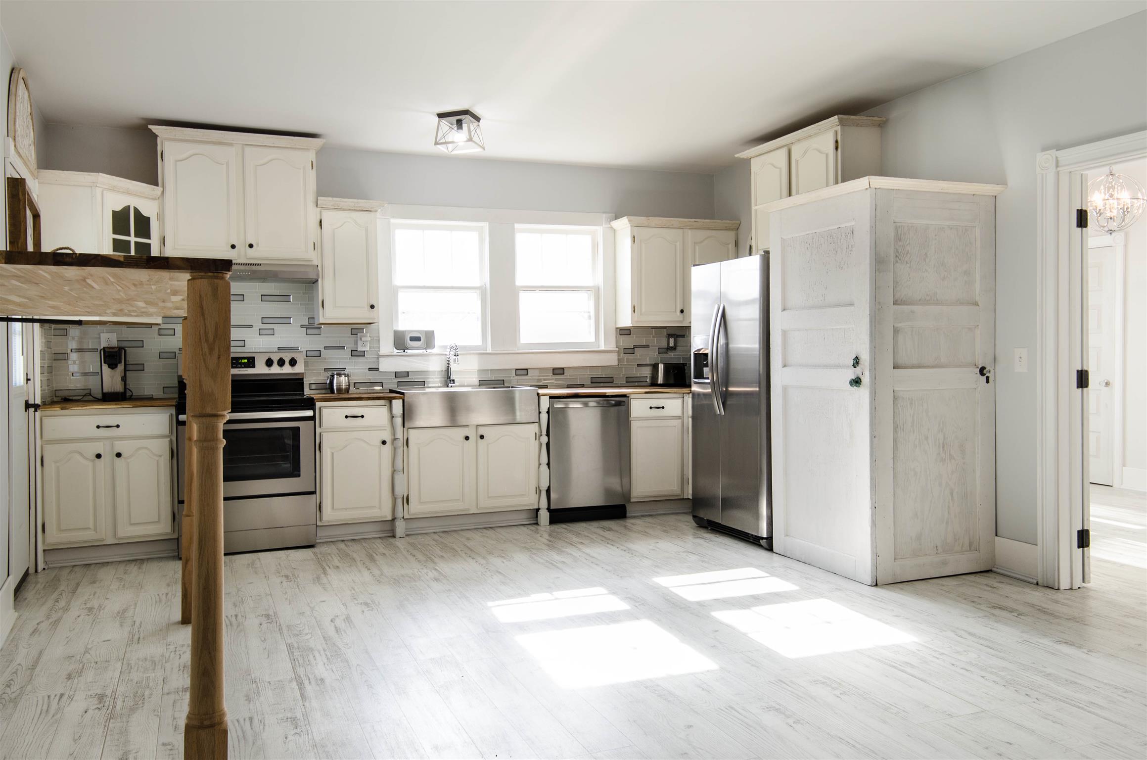 4 Rome First Street Lebanon, TN 37087 - Photo 20 of 25 a kitchen with white cabinets and white appliances