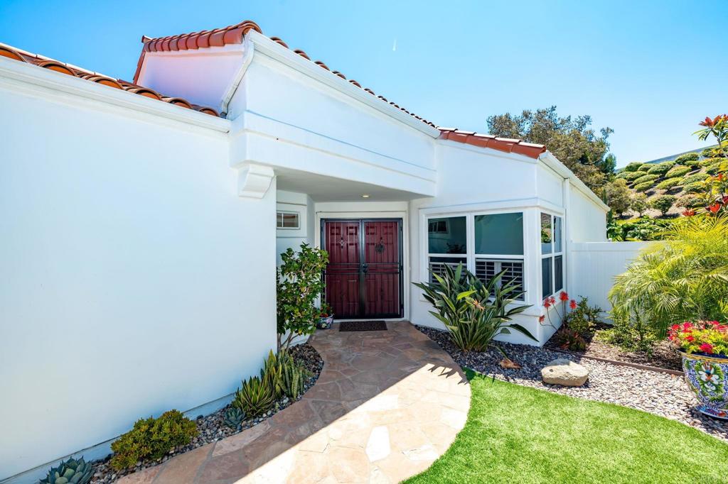 4939 Tilos Way Oceanside, CA 92056 - Photo 10 of 49 a front view of a house with garden