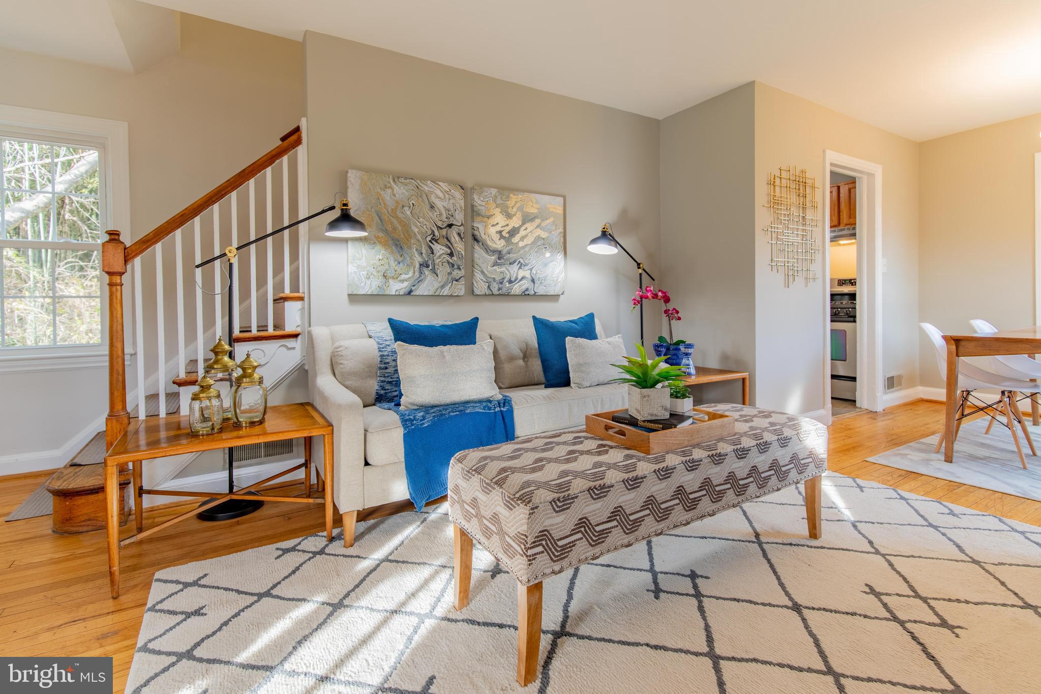 502 East Schuyler Road Silver Spring, MD 20901 - Photo 2 of 29 a living room with patio furniture and a dining table