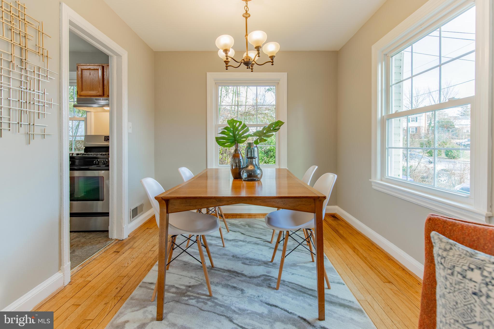 502 East Schuyler Road Silver Spring, MD 20901 - Photo 11 of 29 a view of a dining room with furniture window and wooden floor