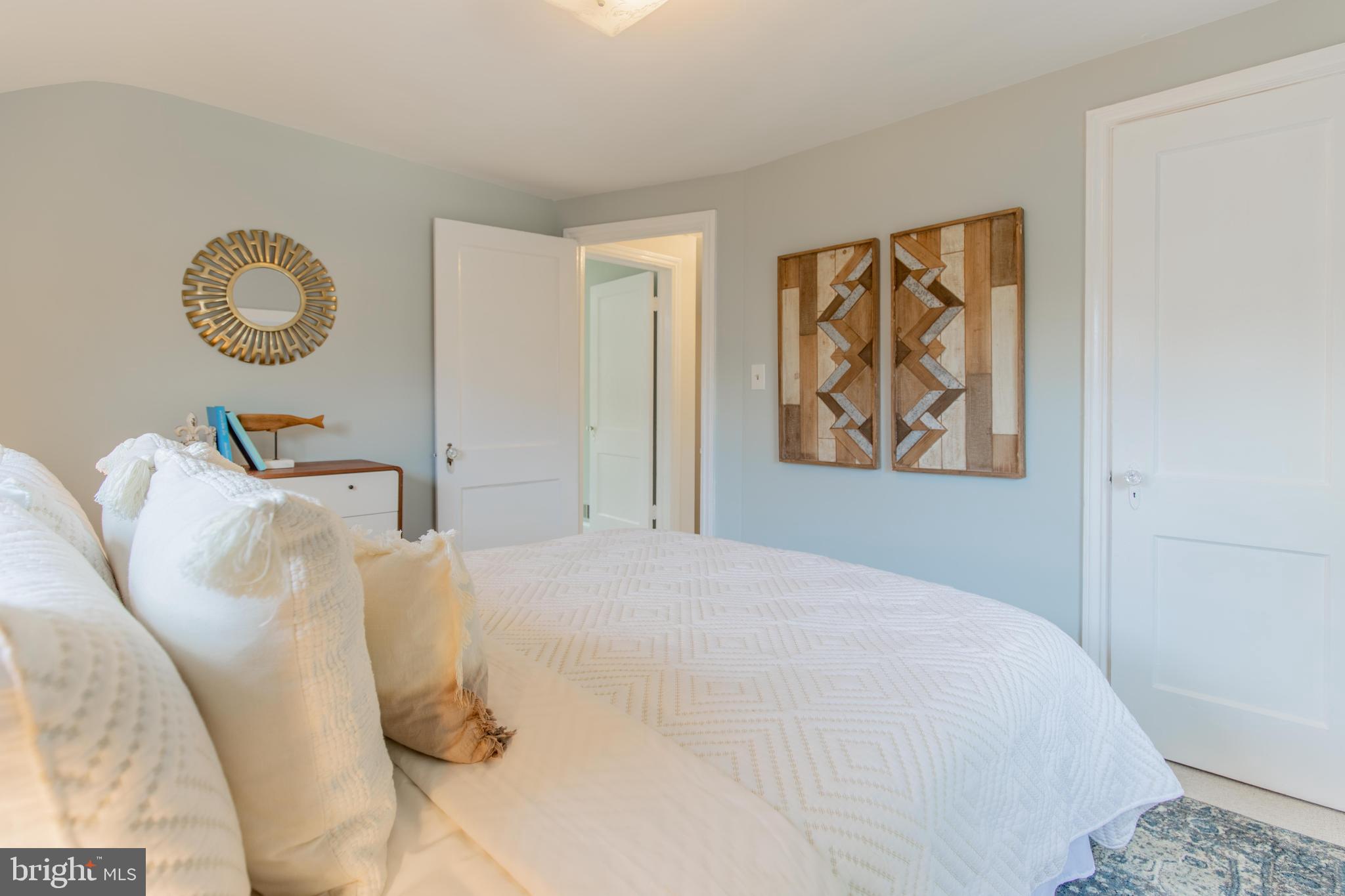 502 East Schuyler Road Silver Spring, MD 20901 - Photo 22 of 29 a bedroom with a bed and painting on the wall