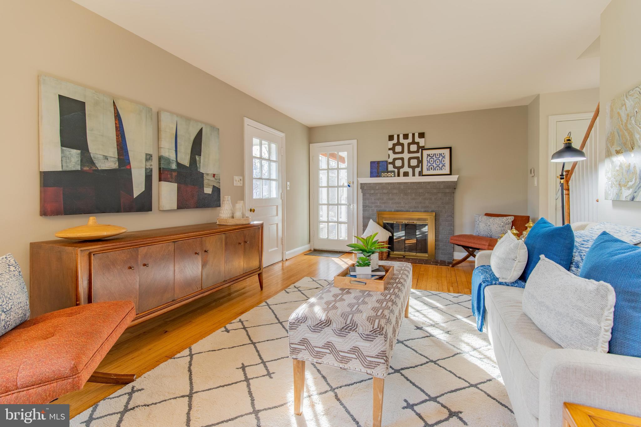 502 East Schuyler Road Silver Spring, MD 20901 - Photo 5 of 29 a living room with furniture and a fireplace