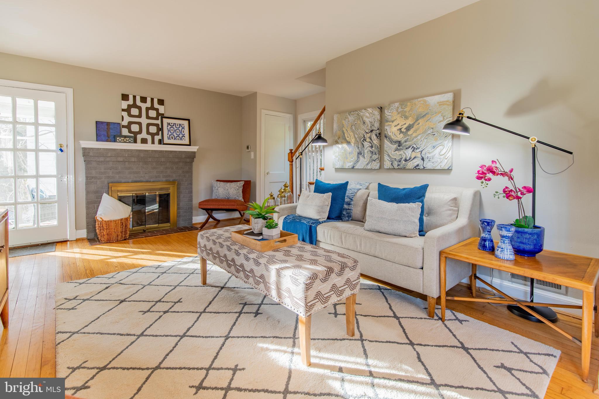 502 East Schuyler Road Silver Spring, MD 20901 - Photo 6 of 29 a living room with furniture and a fireplace