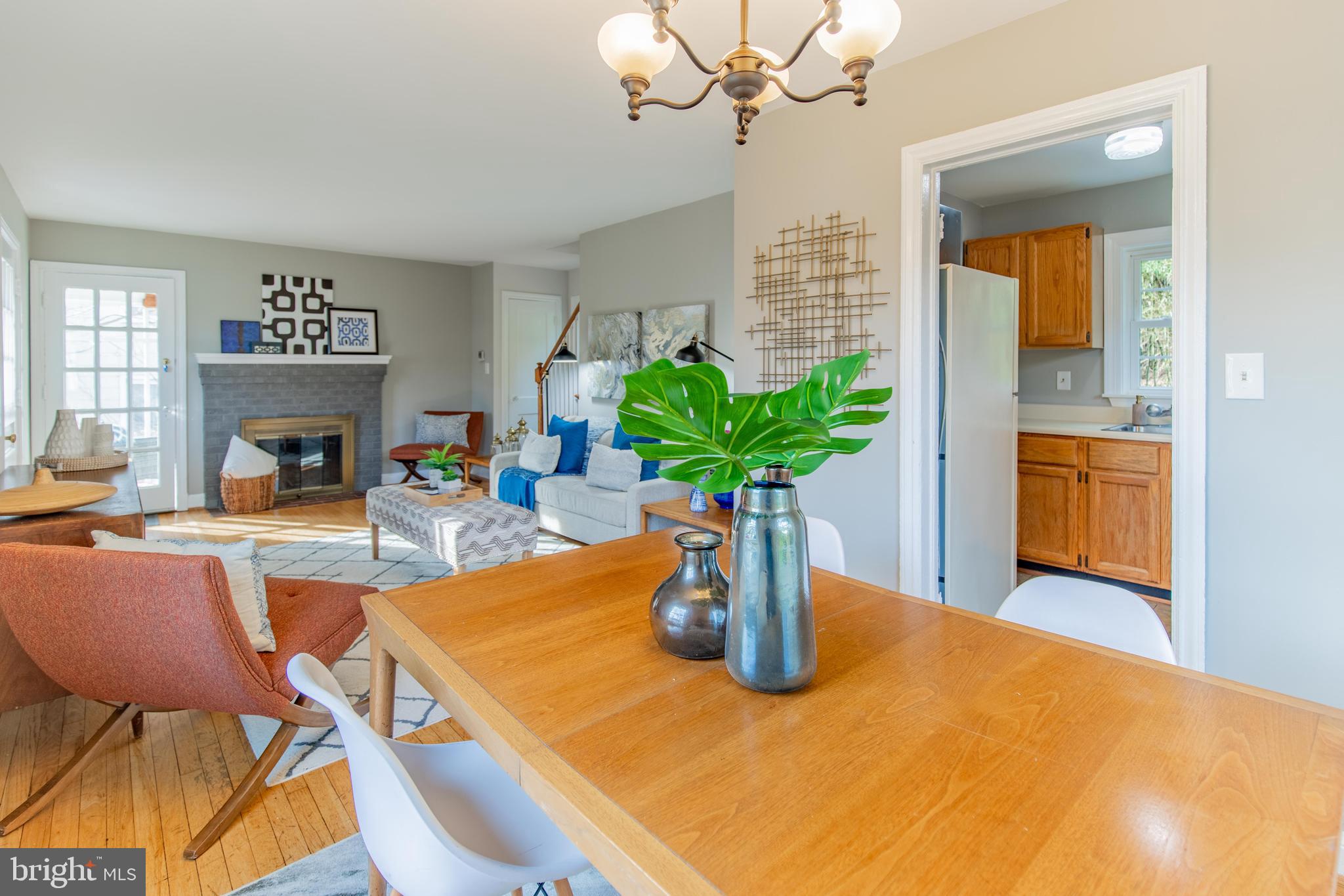 502 East Schuyler Road Silver Spring, MD 20901 - Photo 8 of 29 a dining room with furniture and a fireplace